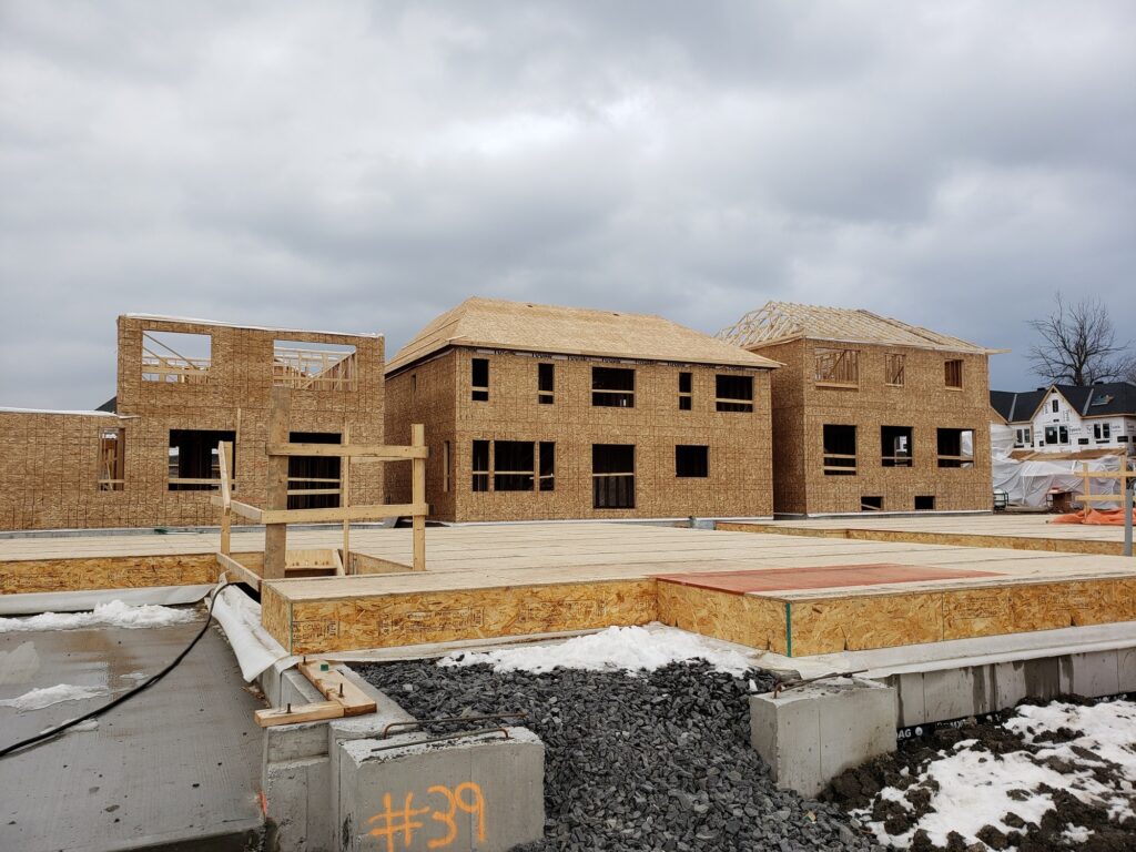 Foundations and framing for new houses building new neighborhoods, city expansion